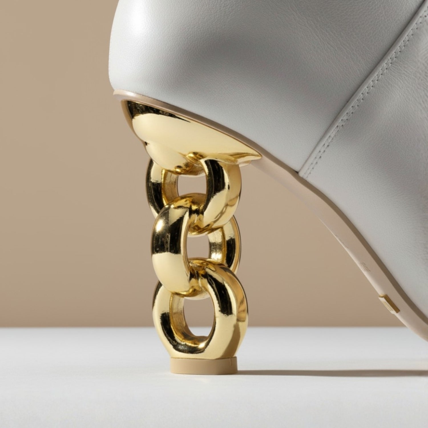 Where art meets fashion. Explore sculptural silhouettes & heels, gold-accented details, and architectural heels that turn every step into a statement.